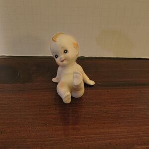 Enesco Porcelain Baby Figurine with Orange Highlights